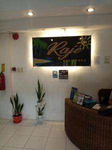 a waiting room with a sign on the wall at Raje Residence in El Nido