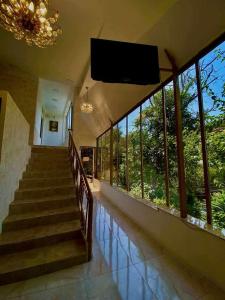 a staircase in a house with a large group of windows at Hotelvvv888 in Yerevan