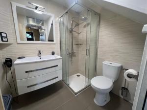 a bathroom with a shower and a toilet and a sink at Le Phare des Baleines in La Flotte +17 photos