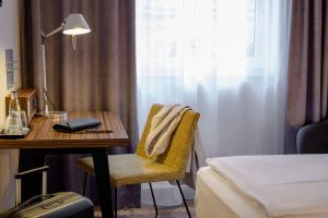 Postel nebo postele na pokoji v ubytování Mercure Hotel Berlin City