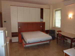 A bed or beds in a room at Beaurivage
