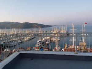 a view of a marina with boats in the water at Kaptan Apart-1 Fethiye Karagözler Evinizden uzak eviniz in Fethiye