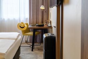Postel nebo postele na pokoji v ubytování Mercure Hotel Berlin City