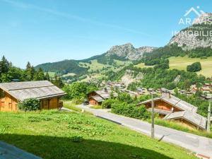 an aerial view of a village in the mountains at Appartement Le Grand-Bornand, 3 pièces, 4 personnes - FR-1-391-103 in Le Grand-Bornand