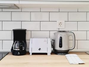 a kitchen counter with a coffee maker and a toaster at Bilbao APARTAMENTOS Zorroza in Bilbao