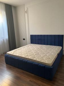 a bed in a room with a blue bed frame at Villa deluxe in Baku +10 photos
