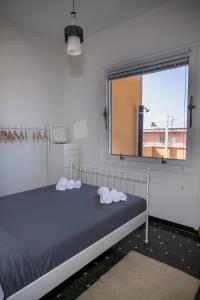 a bedroom with a bed with towels on it at [La Terrazza di Chiavari] in Chiavari