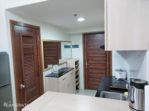 a kitchen with a sink and a counter top at 1 Bedroom RudRose Condo At Horizons 101 Cebu, City in Cebu City
