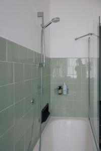 a shower with a glass door in a bathroom at [La Terrazza di Chiavari] in Chiavari