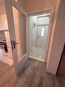an empty room with a door and a mirror at Apartment Rea Ilidža 2 in Sarajevo +9 photos