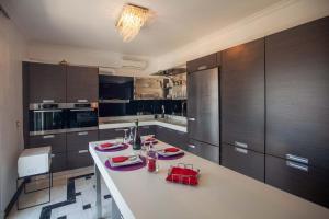 A kitchen or kitchenette at Unique, elegant Bourtzi View Villa
