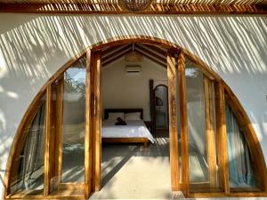 Postel nebo postele na pokoji v ubytování Rumah Canaria Bungalow