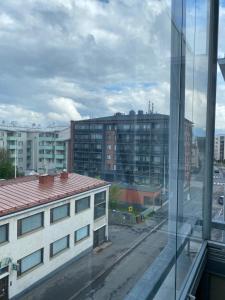 a view from a window of a city with buildings at City Corner in Rovaniemi
