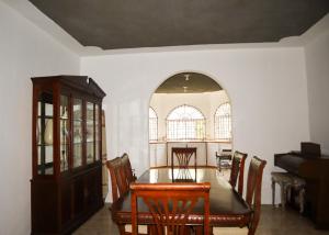 a dining room with a table and chairs at Kokojo Villa in Black River