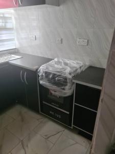 d'une cuisine avec un comptoir et un tas de plastique. dans l'établissement One bed apt Oluyole Akala express axis Ibadan, à Ibadan
