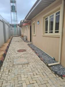 a brick walkway in front of a house at One bed apt Oluyole Akala express axis Ibadan in Ibadan