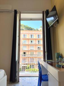 a room with a window with a view of a building at Sorrento Street View in Sorrento