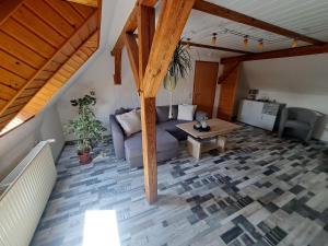 a living room with a couch and a table at Ferienwohnung Feldblick in Saal