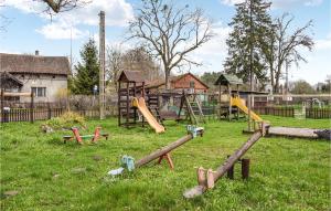 a park with a playground with a slide at 3 Bedroom Nice Home In Stare Kawkowo in Stare Kawkowo
