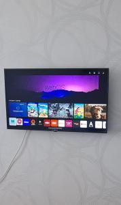 a tablet computer is hanging on a wall at 1 к квартира в Центре Мухита д 128 in Uralsk