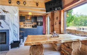 a kitchen with a large wooden table in a cabin at Gorgeous Home In Harzgerode With Kitchen in Harzgerode