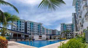 a view of a resort with a swimming pool at Casa Felicitas 2 - Home Feels 2 Bdr Condo Unit at Seawind Condominium in Davao City
