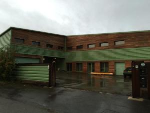 a building with a parking lot in front of it at Évasion du préhaut in Tournehem