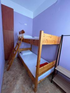 A bed or beds in a room at Teen Hub