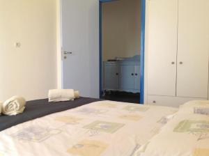 a bedroom with a large bed in a room at Aegean colors apartment in Marmarion +8 photos