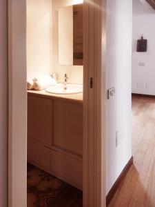 a bathroom with a sink and a mirror at Casa Ginevra in Cagliari +10 photos
