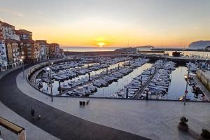 a marina with a bunch of boats in the water at Kofradía By Kabia Gestión in Bermeo