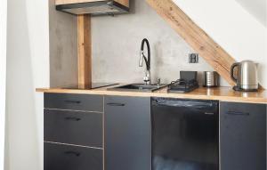 a kitchen with a sink and a stove at Beautiful Home In Swinoujscie With Kitchen in Świnoujście