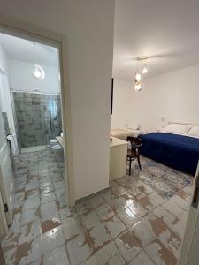 a room with a bed and a room with a bathroom at B&B Centro Storico in Diamante +58 photos