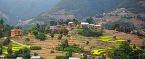a village on top of a hill with houses at Mount Mahabharat Homestay in Panaoti +44 photos