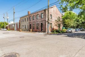 an old brick building on the corner of a street at Historic District Apartment Quiet Street Central Location! in Mobile