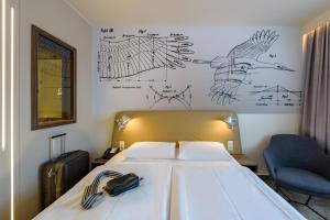 Postel nebo postele na pokoji v ubytování Mercure Hotel Berlin City