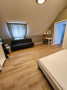 a living room with a couch and a table at Best Prater Apartments in Vienna