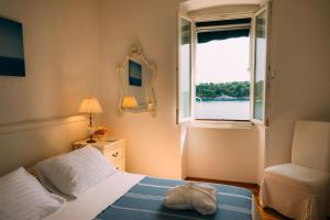 Postel nebo postele na pokoji v ubytování La Casa Isabella