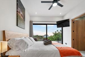 a bedroom with a large bed with a large window at Quiet 3BR Villa in La Punta, Private Pool! in Puerto Escondido