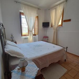 Postel nebo postele na pokoji v ubytování La Casetta