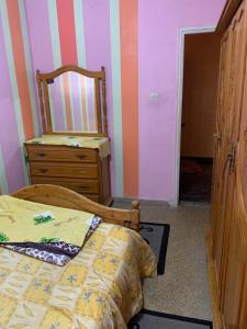 Кровать или кровати в номере N12 quartier el bahara safi, maroc