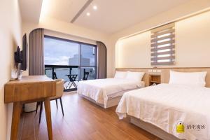 Un pat sau paturi într-o cameră la Lu's B&B