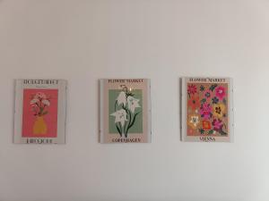 a group of four posters with flowers on them at Apartamento Happy Street in Socuéllamos