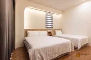 Un pat sau paturi într-o cameră la Lu's B&B