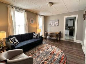 a living room with a couch and a table at Zen Haven 3- Close to Downtown Indianapolis- Queen Bed in Indianapolis