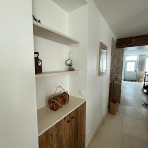 a room with a counter with a purse on it at L'OCEAN a Oleron in Le Château-dʼOléron