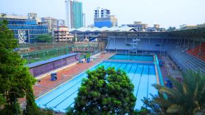an overhead view of a swimming pool in a city at Country Inn by UMRB in Mumbai