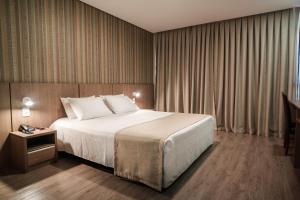 Кровать или кровати в номере Bello Hotel