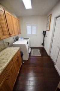 a kitchen with a sink and a toilet in it at Bright and cheerful 4 bedroom home pool in Boca Raton