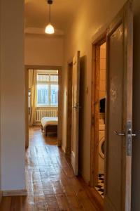 a hallway with a room with a bathroom and a bedroom at A nice, quiet and central place in Riga! in Rīga